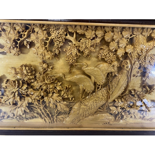 442 - A LARGE CARVED BAMBOO DISPLAY IN WOODEN SURROUND, HEIGHT 46CM