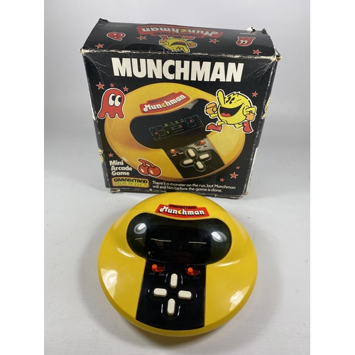 320 - A BOXED RETRO GRANDSTAND MUNCHMAN MINI ARCADE GAME