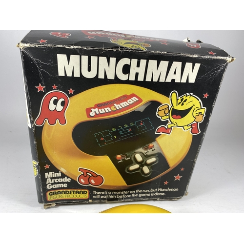 320 - A BOXED RETRO GRANDSTAND MUNCHMAN MINI ARCADE GAME