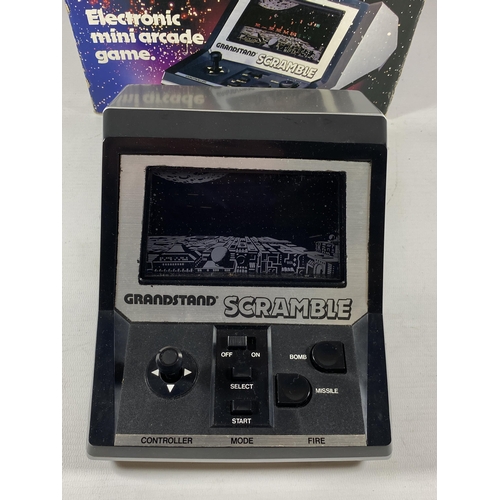 414 - A RETRO BOXED GRANDSTAND SCRAMBLE ELECTRONIC MINI ARCADE GAME