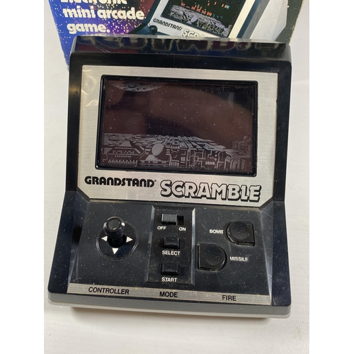 415 - A RETRO BOXED GRANDSTAND SCRAMBLE ELECTRONIC MINI ARCADE GAME