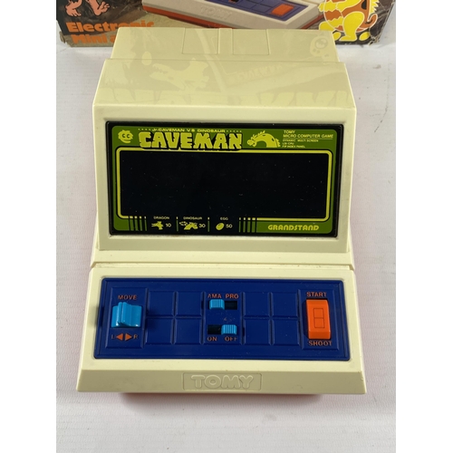 416 - A RETRO BOXED GRANDSTAND CAVE MAN ELECTRONIC MINI ARCADE GAME