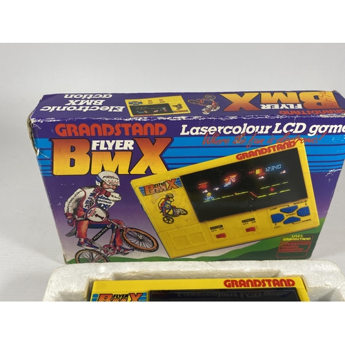 419 - A RETRO BOXED GRANDSTAND FLYER BMX LASERCOLOUR LCD GAME