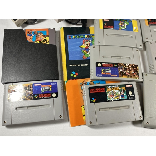 431 - A GROUP OF RETRO SUPER NINTENDO GAMES, SUPER MARIO WORLD, CONTROLLERS ETC