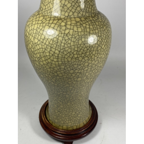 444 - A LARGE CHINESE CELADON CRACKLE GLAZE VASE ON WOODEN STAND, HEIGHT 38CM