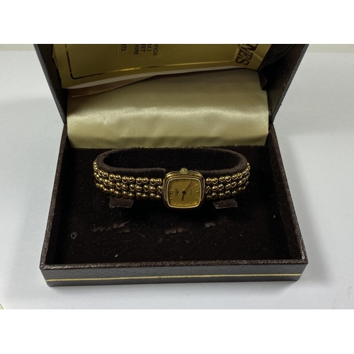 634 - A BOXED LADIES LONGINES GOLD PLATED WATCH WITH PURCHASE RECEIPT