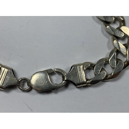 667 - A MARKED SILVER HEAVY FLAT LINK BRACELET