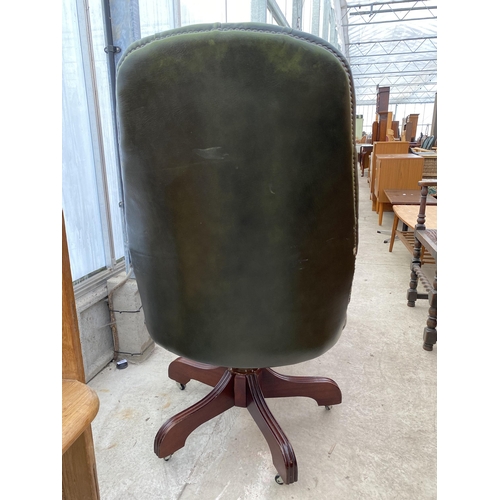 2519 - A GREEN BUTTON-BACK SWIVEL DESK CHAIR WITH TURNED UPRIGHTS