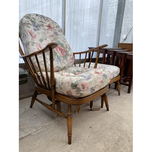 2520 - AN ERCOL FURNITURE WHEELBACK FIRESIDE CHAIR AND STOOL