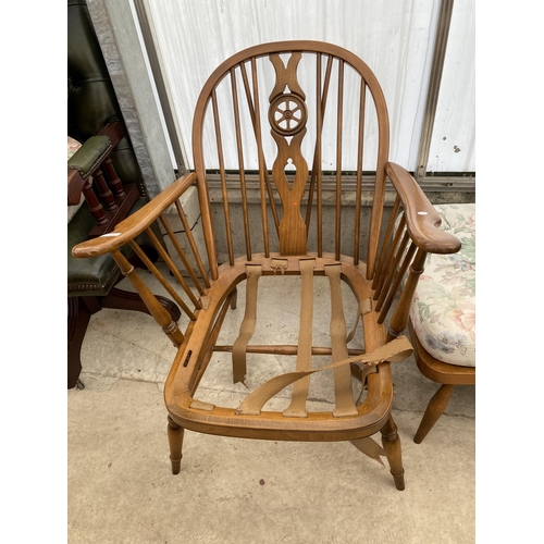 2520 - AN ERCOL FURNITURE WHEELBACK FIRESIDE CHAIR AND STOOL