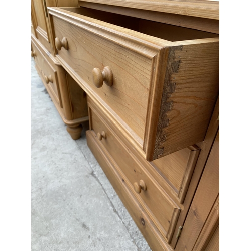 2528 - A PINE SIDEBOARD ENCLOSING THREE DRAWERS AND TWO CUPBOARDS, 52