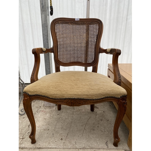 2545 - A CONTINENTAL STYLE OPEN ARMCHAIR WITH SPLIT CANE BACK