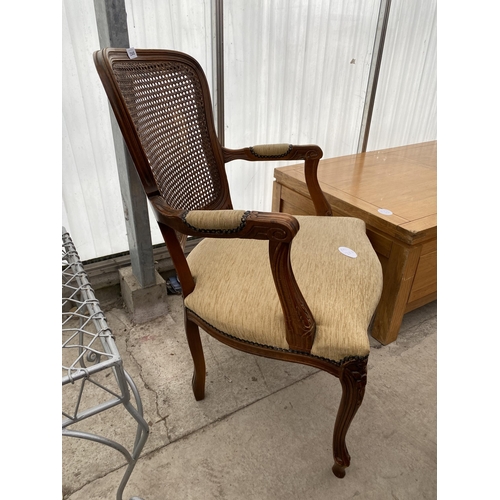 2545 - A CONTINENTAL STYLE OPEN ARMCHAIR WITH SPLIT CANE BACK