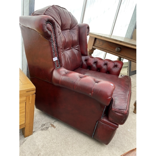 2547 - A LEATHER PEGASUS OXBLOOD EASY CHAIR WITH BUTTON-BACK