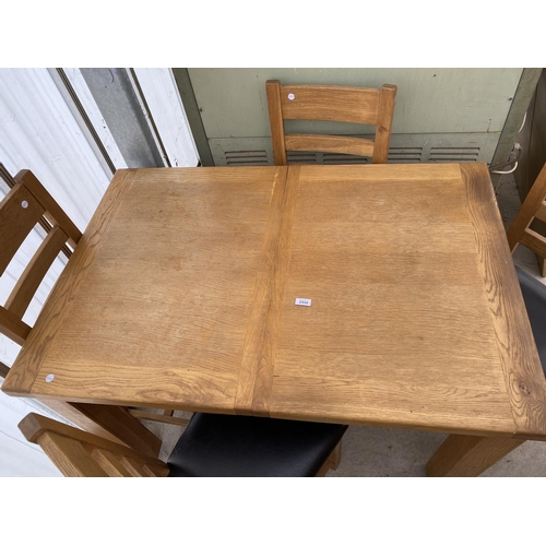 2550 - AN OAK EXTENDING DINING TABLE, 47X32