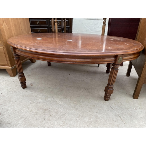 2554 - AN OVAL COFFEE TABLE