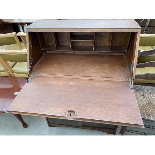 2561 - A MID 20TH CENTURY OAK BUREAU, 30