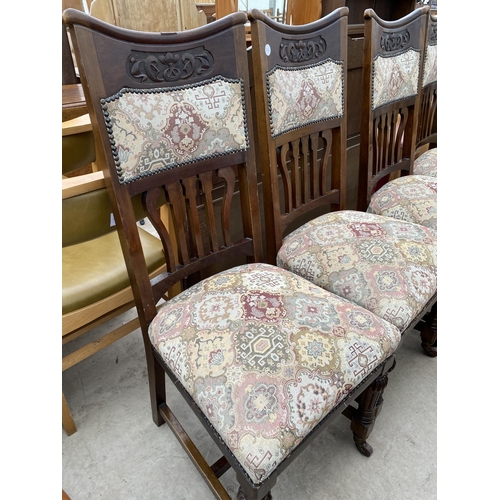 2564 - A SET OF FOUR ART NOUVEAU BEECH DINING CHAIRS ON TURNED AND FLUTED FRONT LEGS