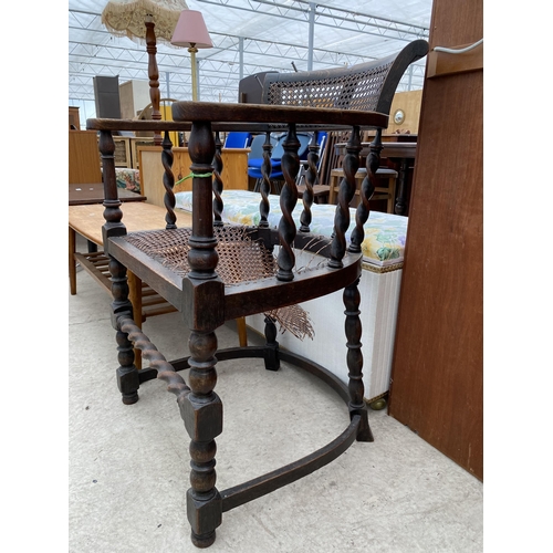 2579 - AN EARLY 20TH CENTURY OAK BARLEYTWIST TUB CHAIR WITH CANE SEAT AND BACK (A/F)