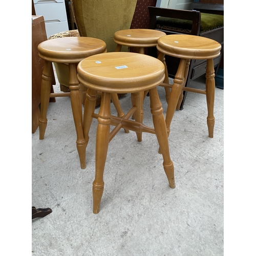 2583 - A SET OF FOUR BEECH STOOLS ON TURNED LEGS