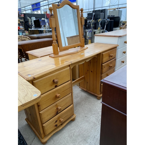 2590 - A PINE TWIN-PEDESTAL DRESSING TABLE WITH EIGHT DRAWERS AND SWING FRAME MIRROR, 54