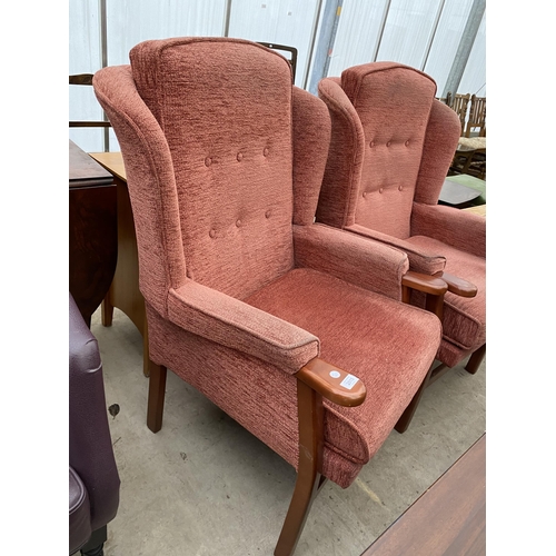 2615 - A PAIR OF UPHOLSTERED WING BACK FIRESIDE CHAIRS