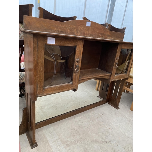 2624 - AN OAK ART NOUVEAU SIDEBOARD BACK WITH MIRRORED SECTION AND TWO BOWED GLASS DOORS, 48