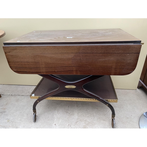 2645 - A 1960'S TWO TIER MAHOGANY TROLLEY ON X-FRAME WITH BRASS GALLERY TO THE LOWER TIER AND BRASS HANDLES