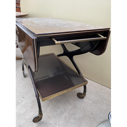 2645 - A 1960'S TWO TIER MAHOGANY TROLLEY ON X-FRAME WITH BRASS GALLERY TO THE LOWER TIER AND BRASS HANDLES