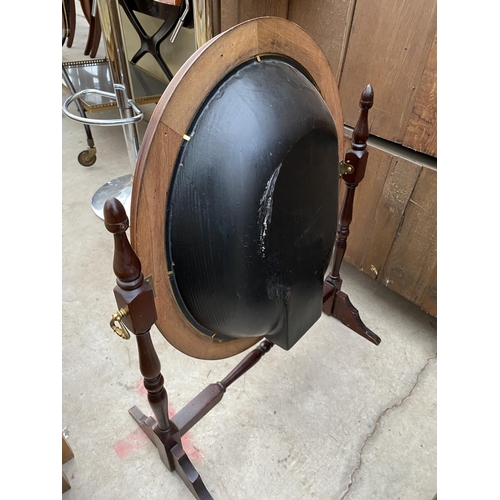 2647 - A FIRESCREEN, THE OVAL SWING FRAME DECORATED WITH DRIED FLOWERS