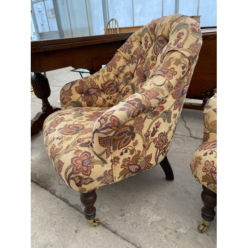 2677 - A 'STUART JONES' TUB CHAIR ON TURNED FRONT LEGS, WITH BRASS CASTERS