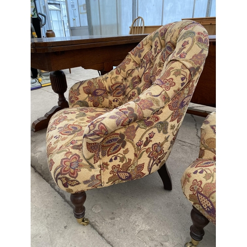 2678 - A 'STUART JONES' TUB CHAIR ON TURNED FRONT LEGS, WITH BRASS CASTERS