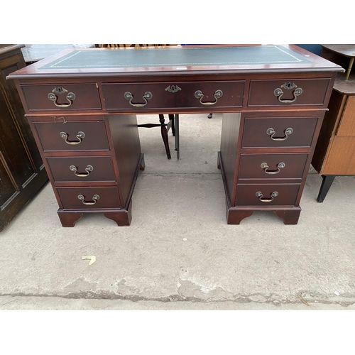 2688 - A MAHOGANY TWIN-PEDESTAL DESK WITH INSET LEATHER TOP AND EIGHT DRAWERS, 48 X 24