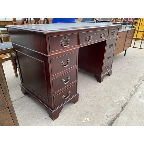 2688 - A MAHOGANY TWIN-PEDESTAL DESK WITH INSET LEATHER TOP AND EIGHT DRAWERS, 48 X 24