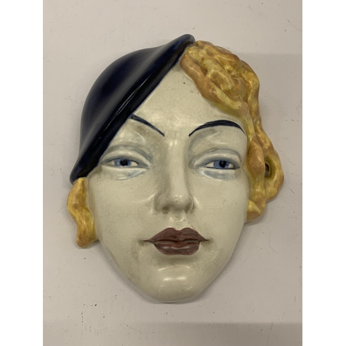 34 - AN ART DECO STYLE FACE MASK, STAMPED 197, MADE IN ENGLAND