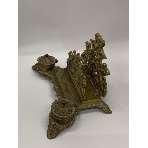 35 - A DECORATIVE BRASS INKSTAND