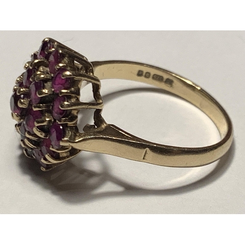 527 - A 9 CARAT GOLD RING WITH A CLUSTER OF NINETEEN RUBIES SIZE R/S IN A PRESENTATION BOX