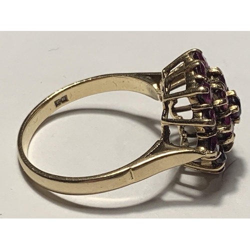 527 - A 9 CARAT GOLD RING WITH A CLUSTER OF NINETEEN RUBIES SIZE R/S IN A PRESENTATION BOX