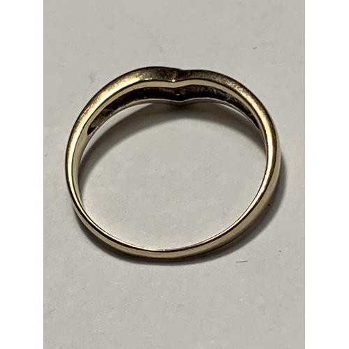 530 - A 9 CARAT GOLD WISHBONE RING WITH FOUR DIAMONDS SIZE M