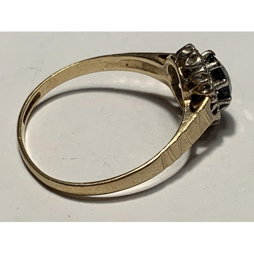 674 - A 9 CARAT GOLD RING WITH A CENTRE SAPPHIRE SURROUNDED BY DIAMONDS SIZE SIZE Q