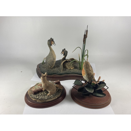 731 - THREE BORDER FINE ARTS FIGURES ON PLINTHS TO INCLUDE GREAT CRESTED GREBES, THE GARDNER RABBIT AND A ... 