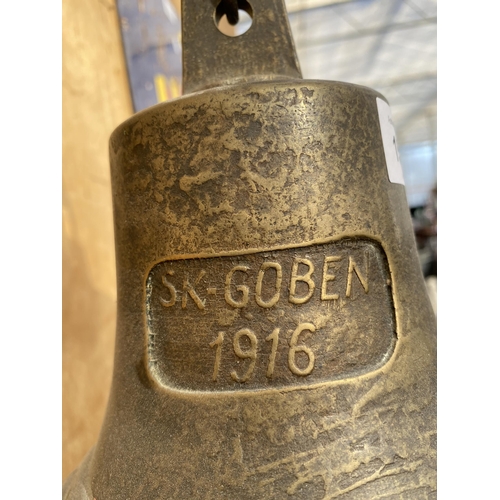 1506 - A BRASS WALL MOUNTED BELL WITH ANCHOR MOUNT AND BEARING THE STAMP 'SK-GOBEN 1916'