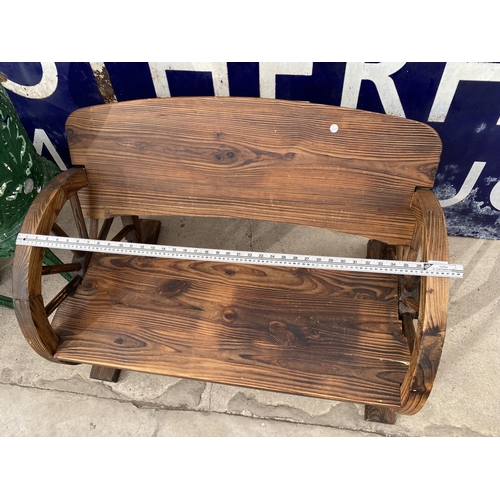 1510 - A WOODEN GARDEN TWO SEATER BENCH WITH CART WHEEL BENCH ENDS (L:98CM)