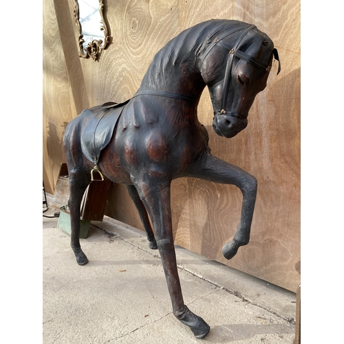 1526 - A LARGE VINTAGE LIBERTY STYLE LEATHER COVERED HORSE, HEIGHT 100CM, LENGTH 122CM