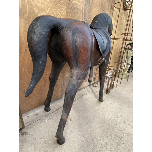 1526 - A LARGE VINTAGE LIBERTY STYLE LEATHER COVERED HORSE, HEIGHT 100CM, LENGTH 122CM