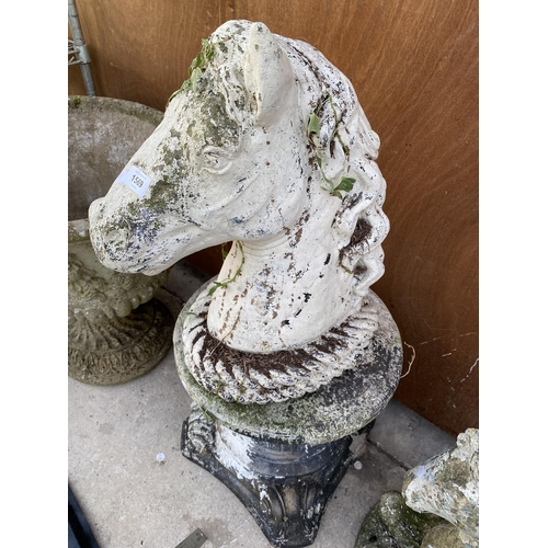 1569 - A RECONSTITUTED STONE HORSES HEAD WITH PEDESTAL BASE