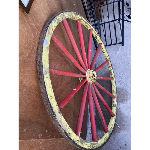 1590 - A WOODEN CART WHEEL WITH METAL BANDING