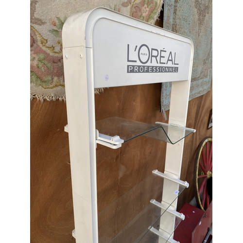 1593 - A VINTAGE DOUBLE SIDED L'OREAL PARIS SHOP DISPLAY STAND WITH GLASS SHELVES