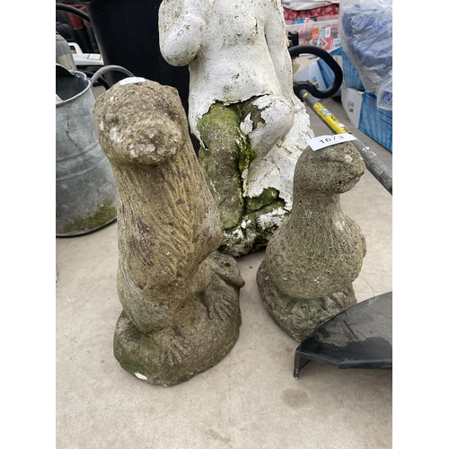 1673 - THREE RECONSTITUTED STONE GARDEN FIGURES TO INCLUDE AN OTTER AND A CHERUB ETC