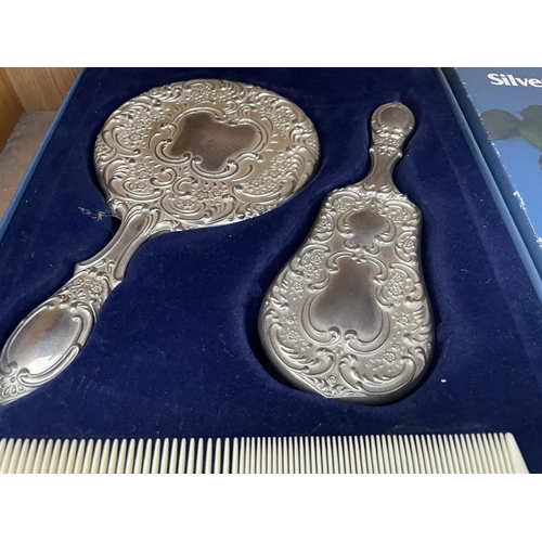 1720 - A BOXED SILVER PLATE DRESSER SET